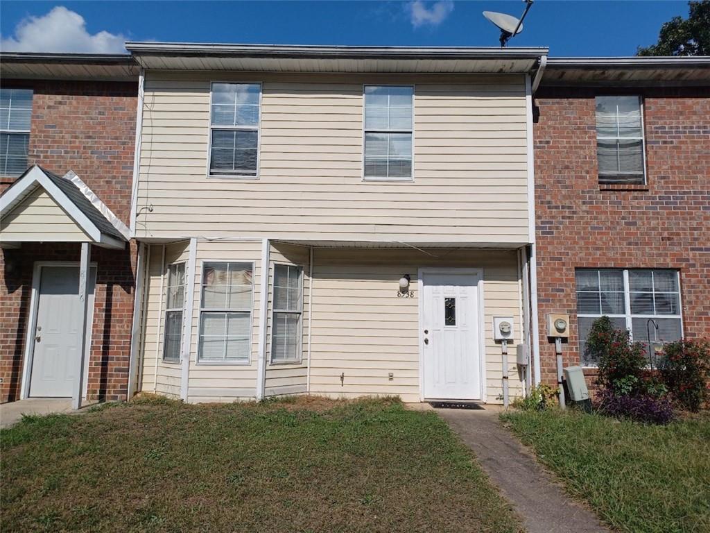 a front view of a house with a garage