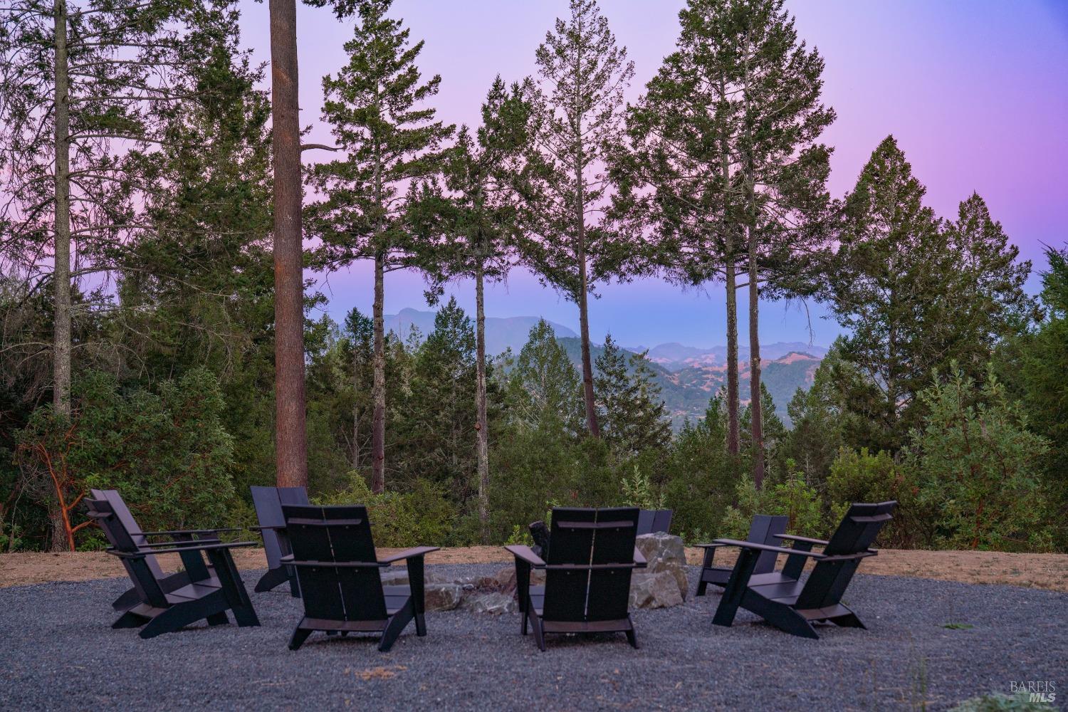 a backyard of a house with table and chairs