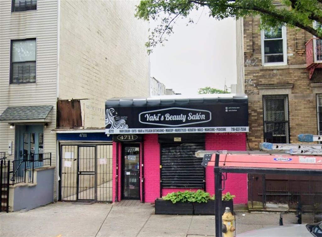 a view of a cafe with retail shops