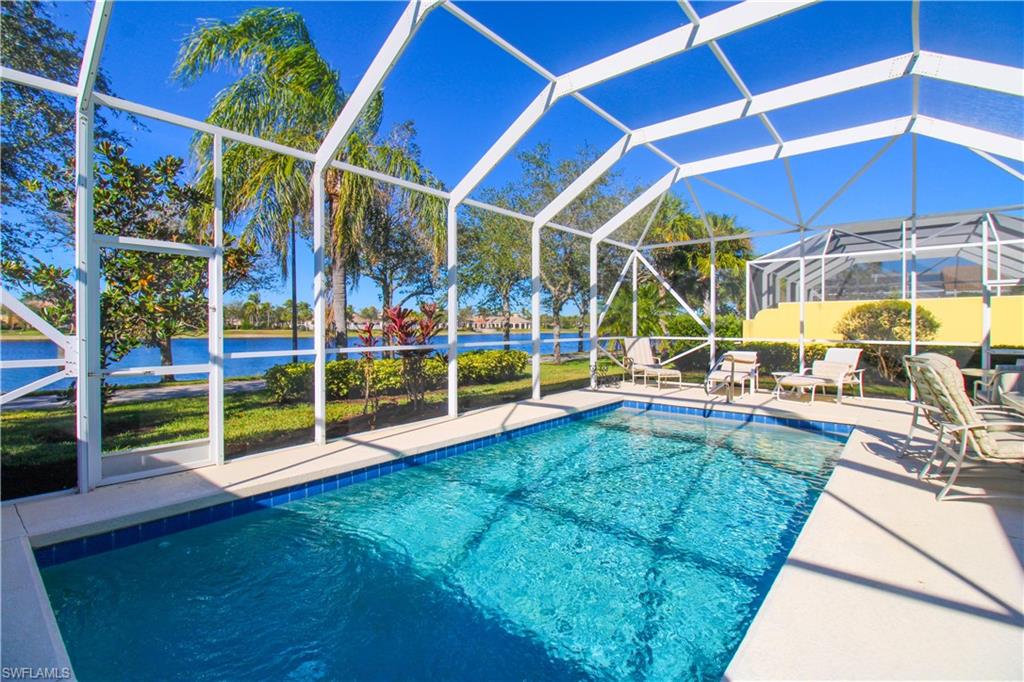 a view of a backyard with swimming pool