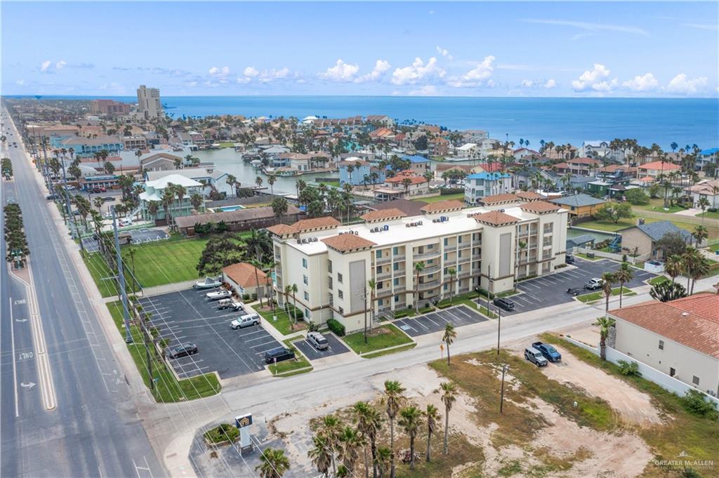 Birds eye view of property with a water view