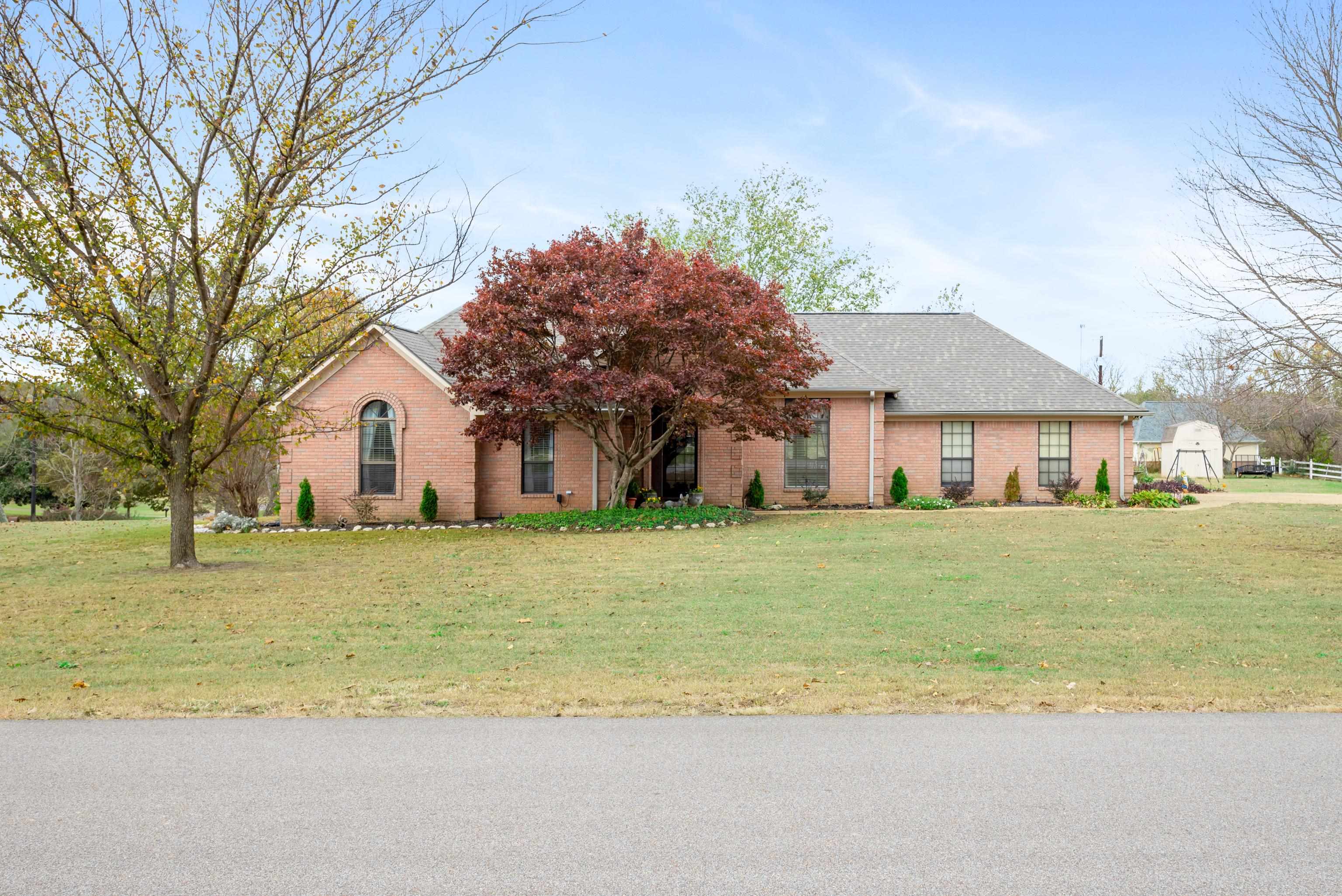 Single story home featuring a front yard