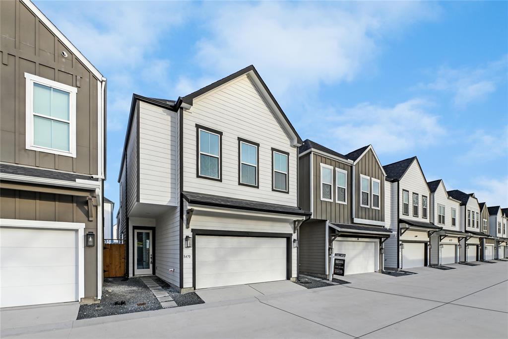 a front view of a house with garage