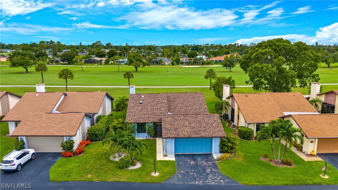 an aerial view of a house with a garden