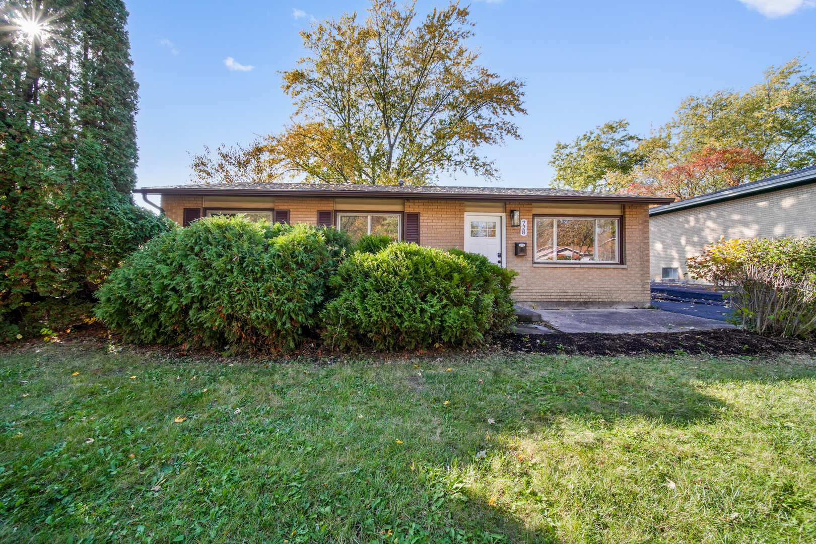 front view of a house with a yard