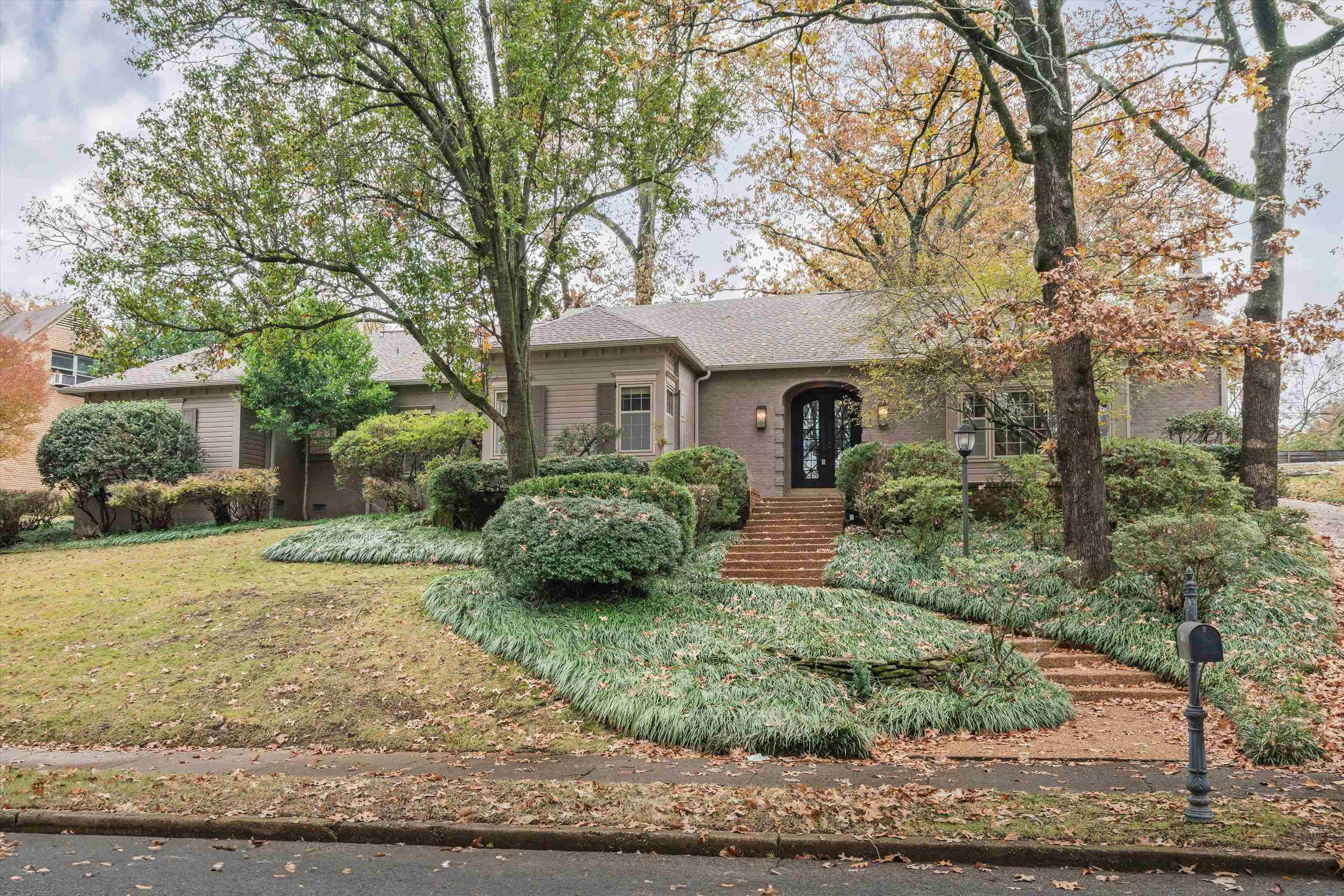 a front view of a house with garden