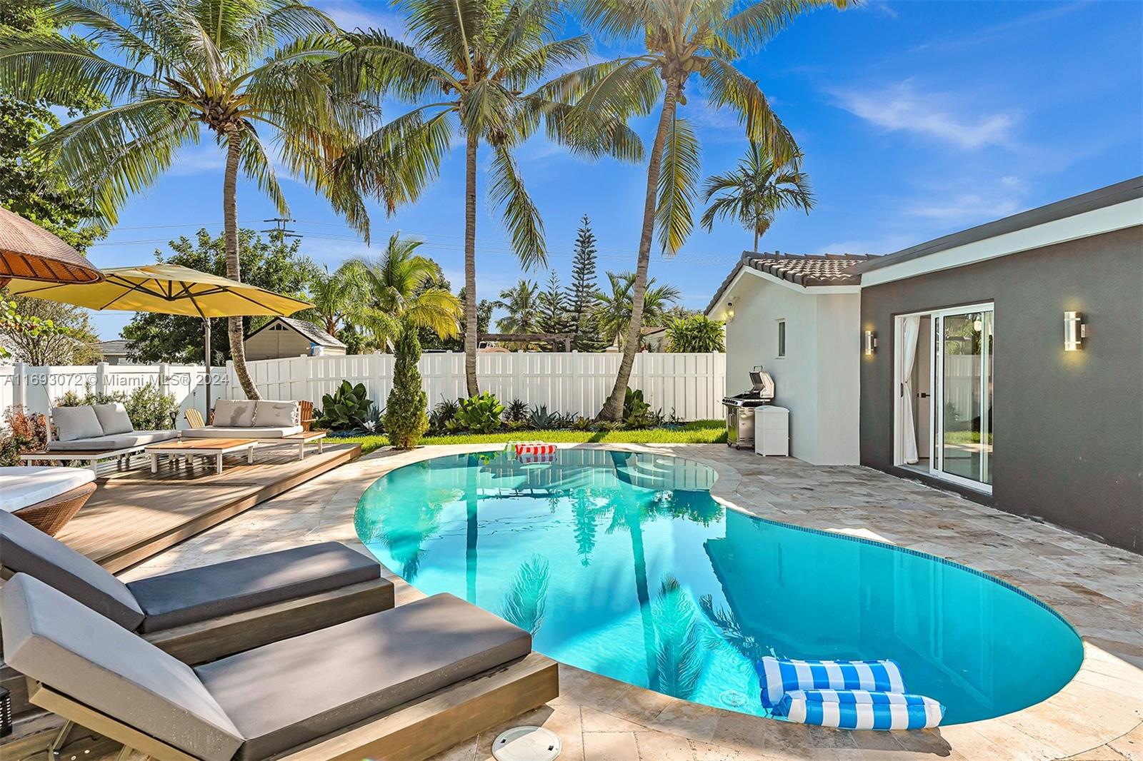 a view of a swimming pool with a lounge chairs