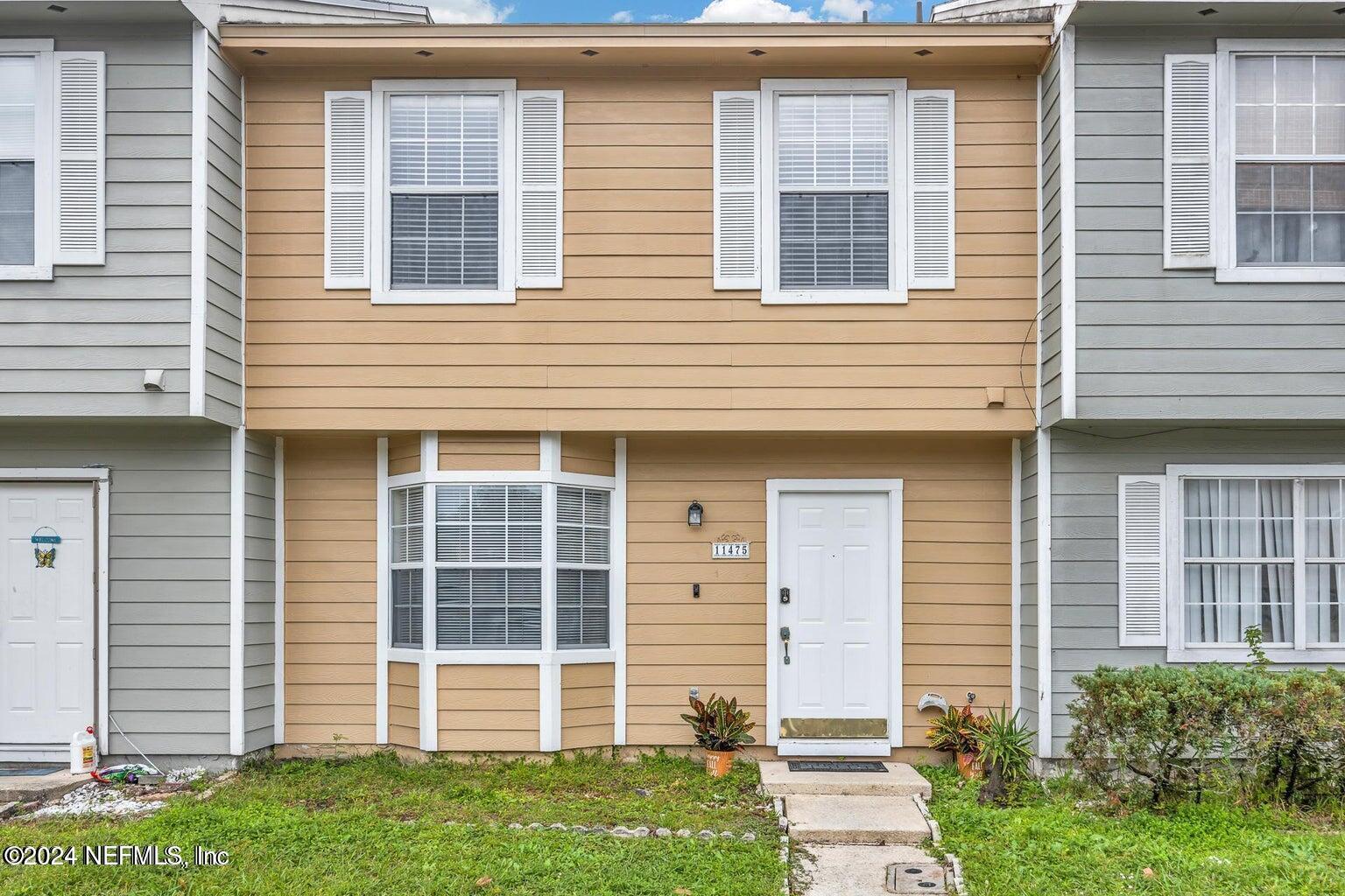 a front view of a house with a yard