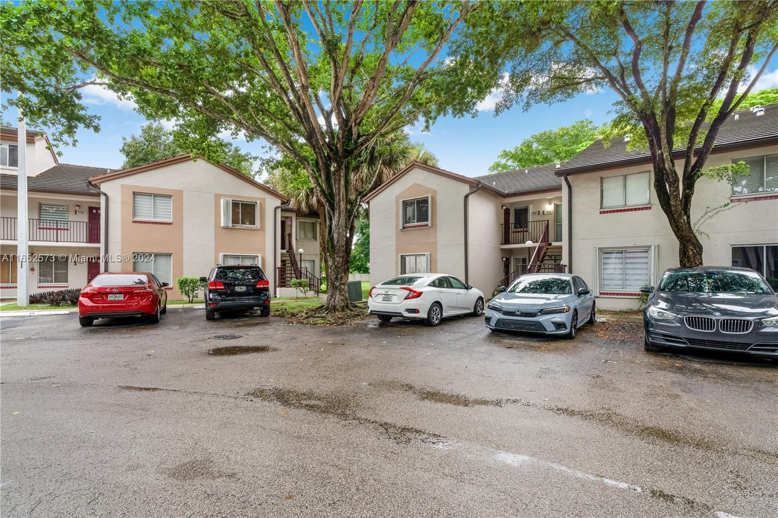 a view of a cars parked in front of a house