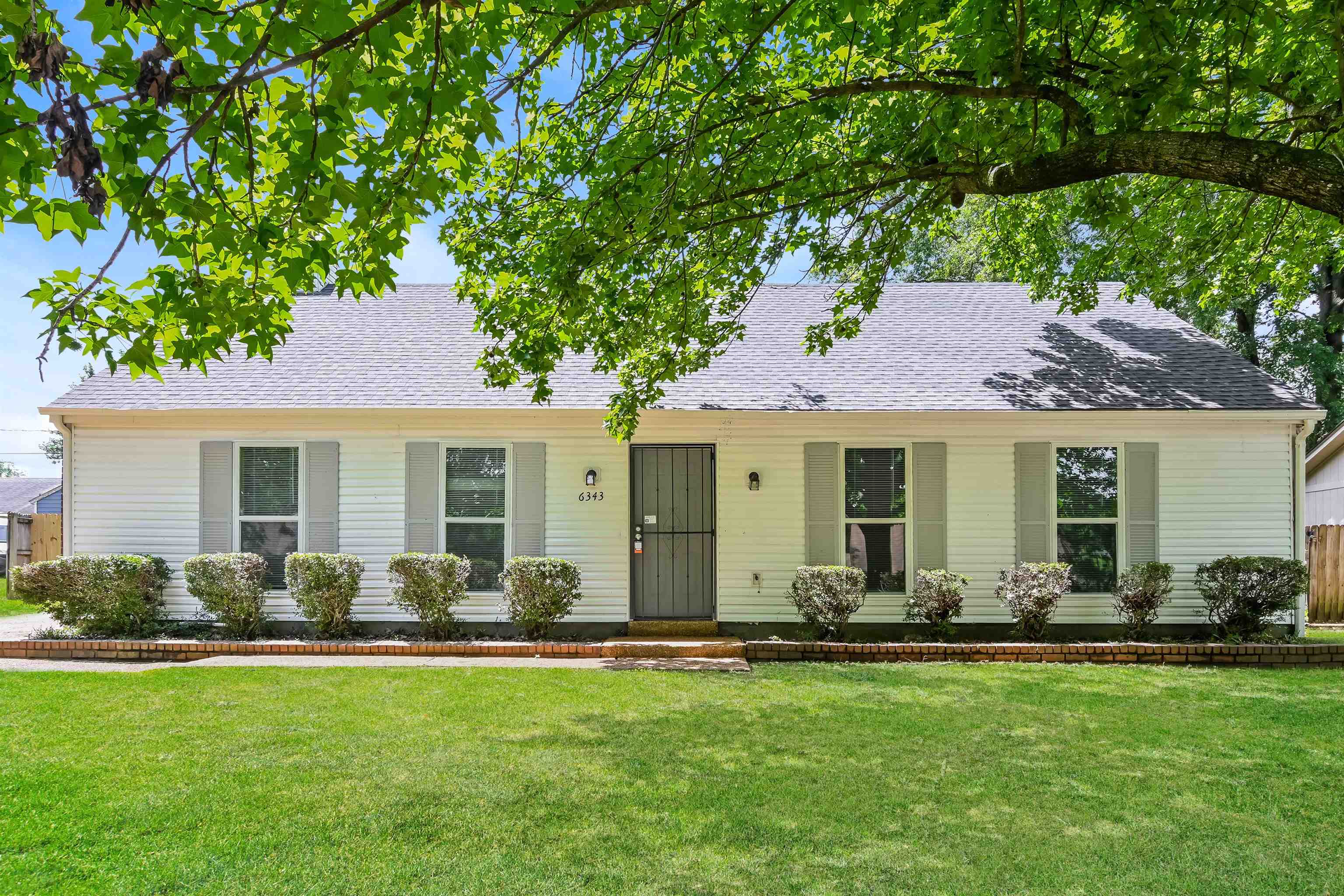 a front view of house with yard having outdoor seating