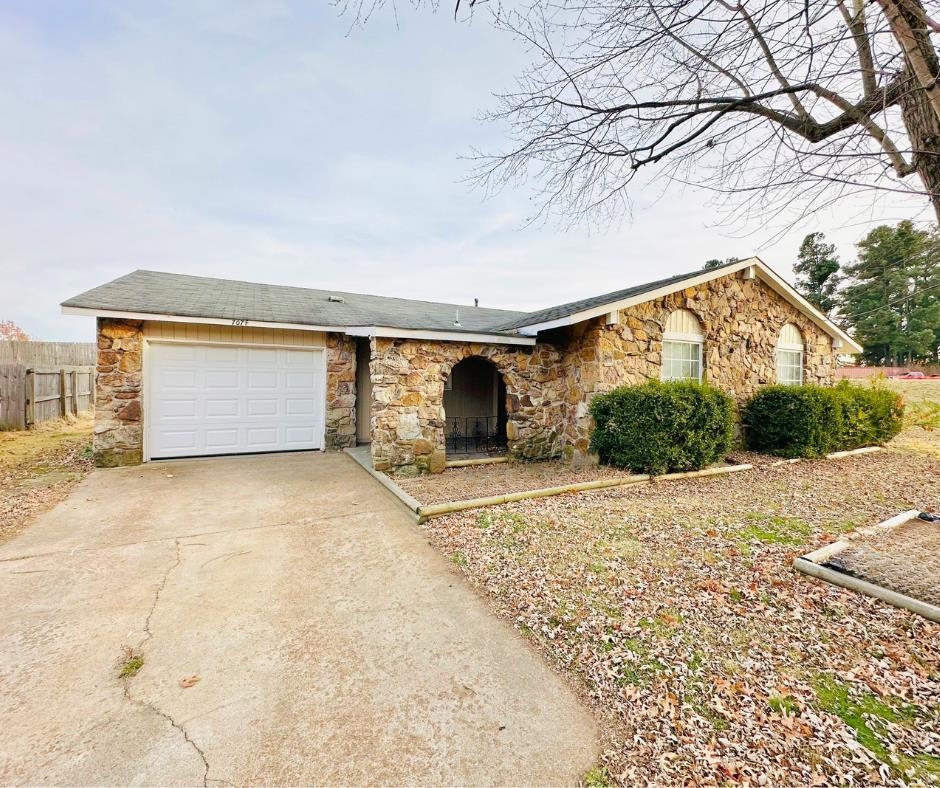 Single story home with a garage