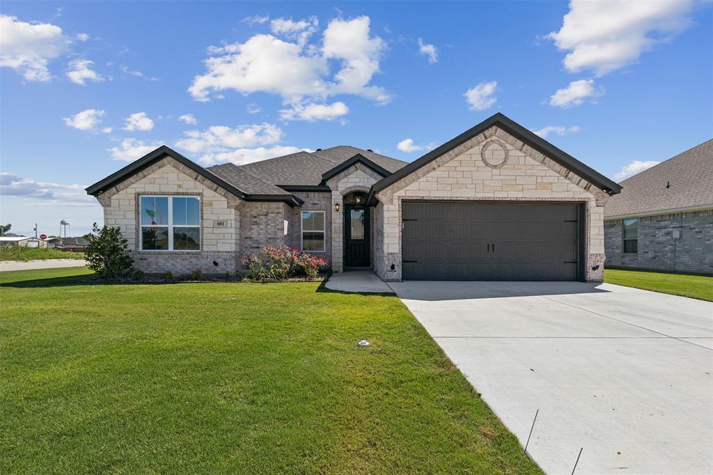 a front view of a house with yard