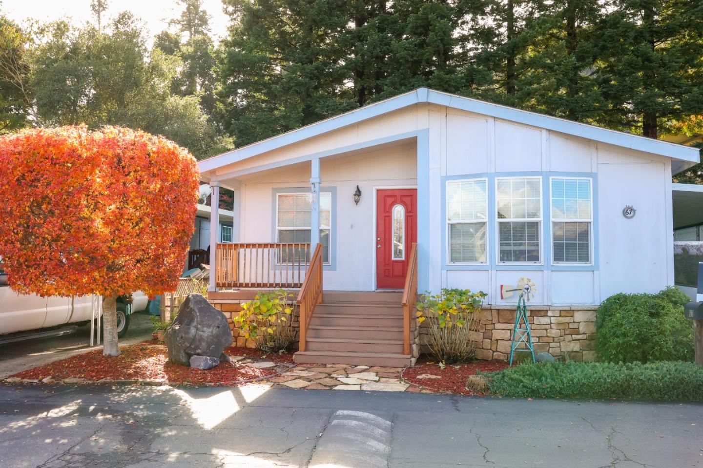 a front view of a house with garden