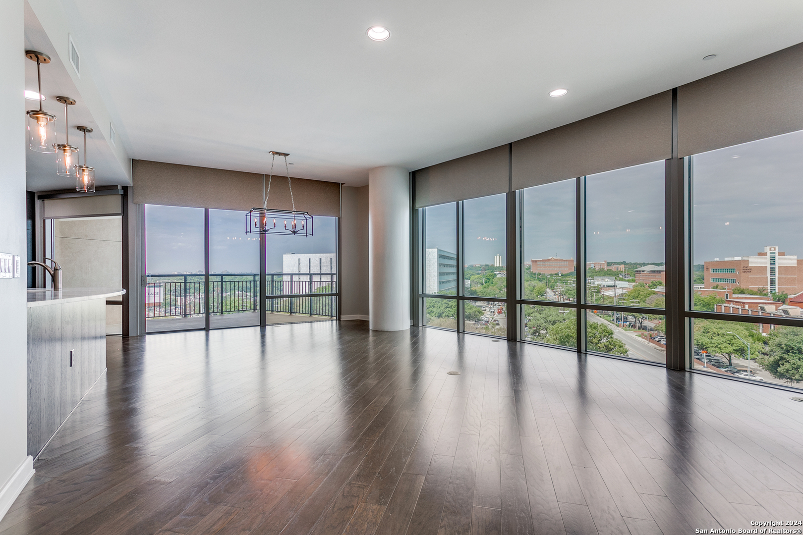 a view of an entryway with wooden floor