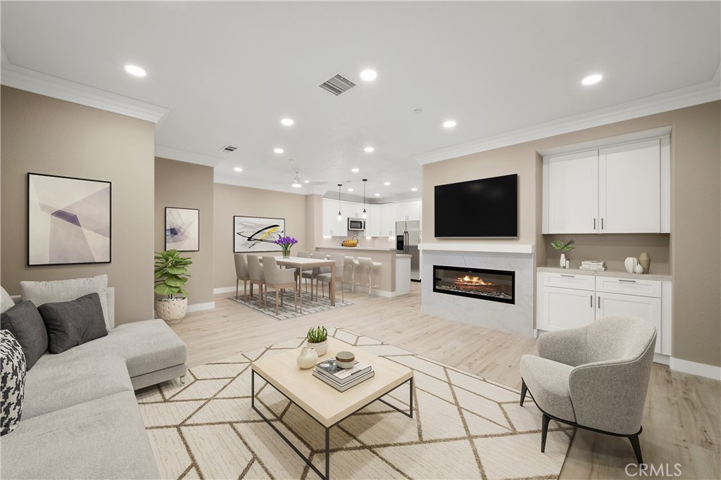 a living room with fireplace furniture and a flat screen tv