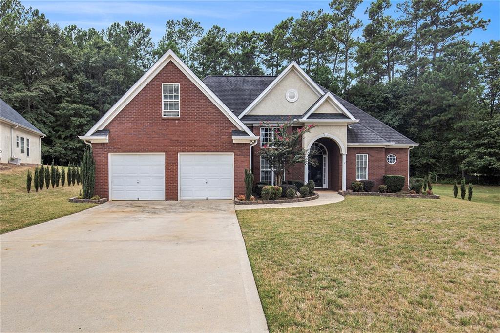 a front view of a house with yard