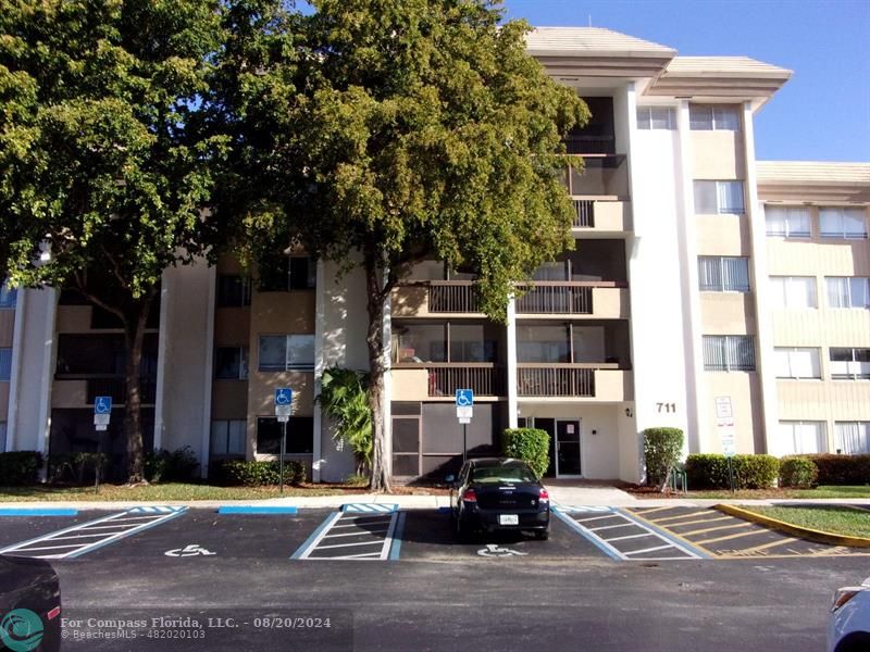 a front view of a building with street view