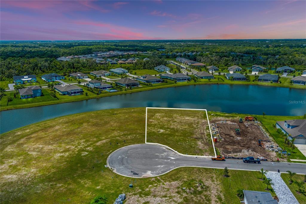 a view of a lake with a house in the background