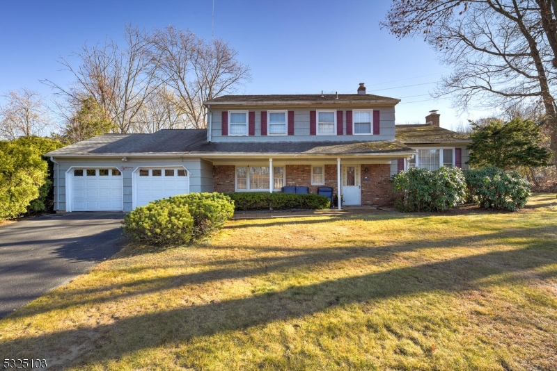 a front view of a house with a swimming pool