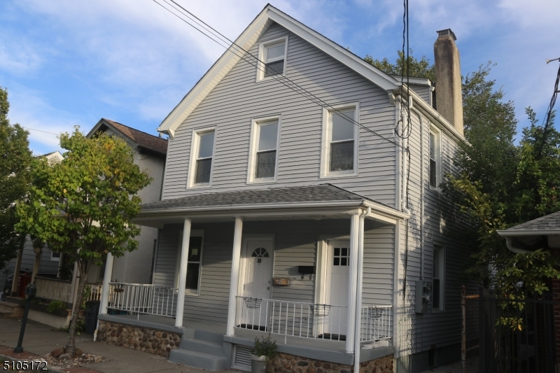 a front view of a house with glass windows