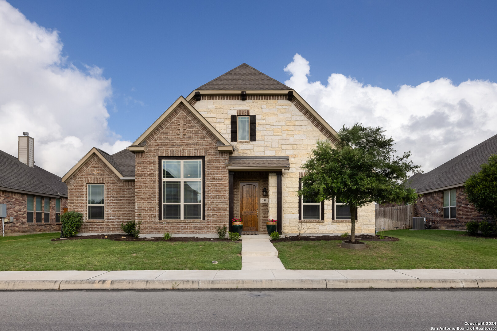 front view of a house and a yard