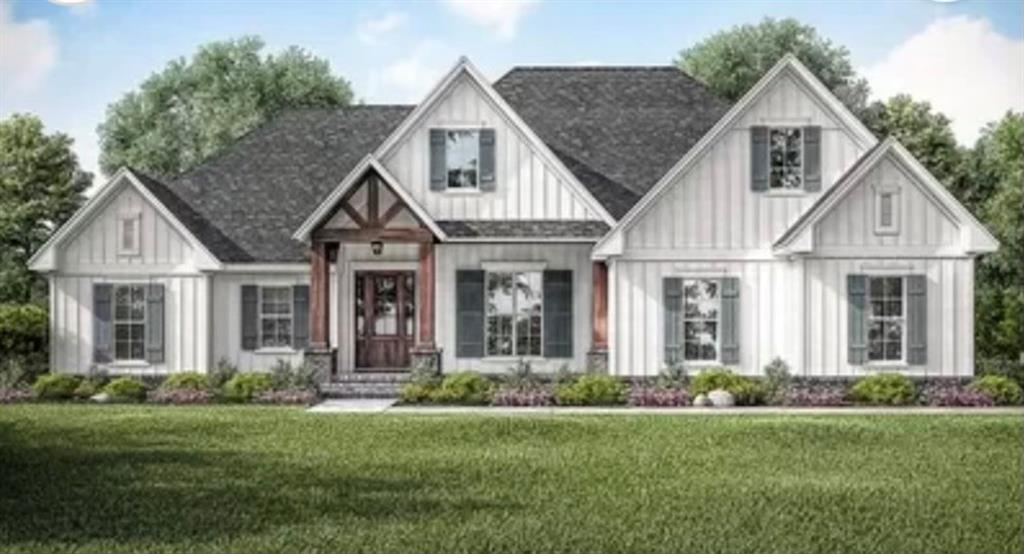 a front view of a house with a yard and porch