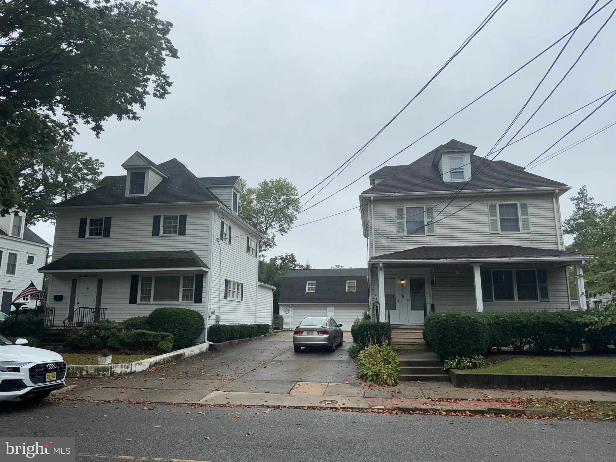 a front view of a residential houses with yard