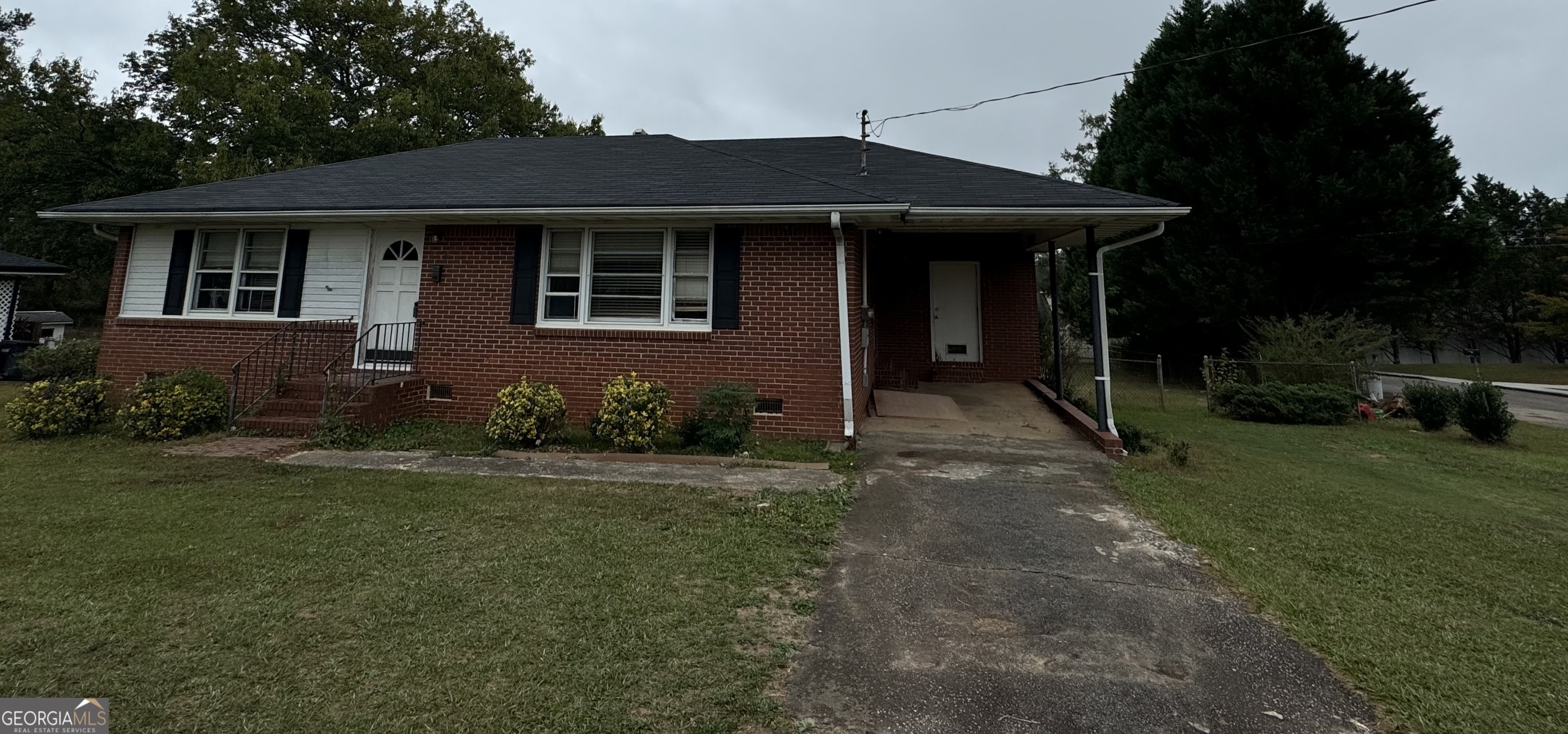 a front view of a house with garden