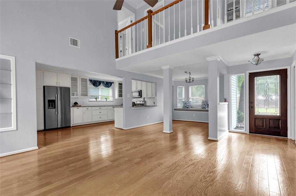 a view of a kitchen with wooden floor and a kitchen