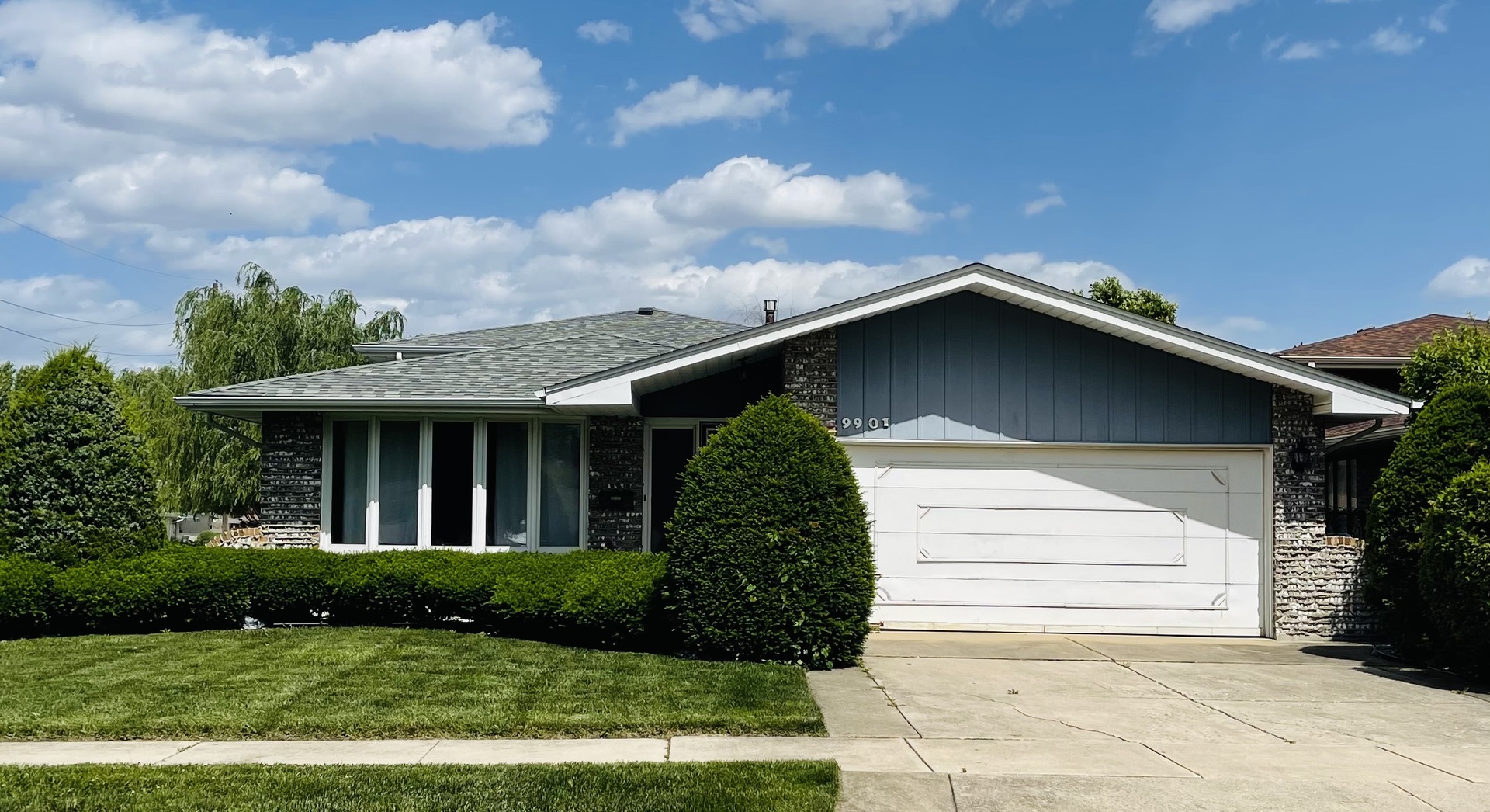 a front view of a house with garden