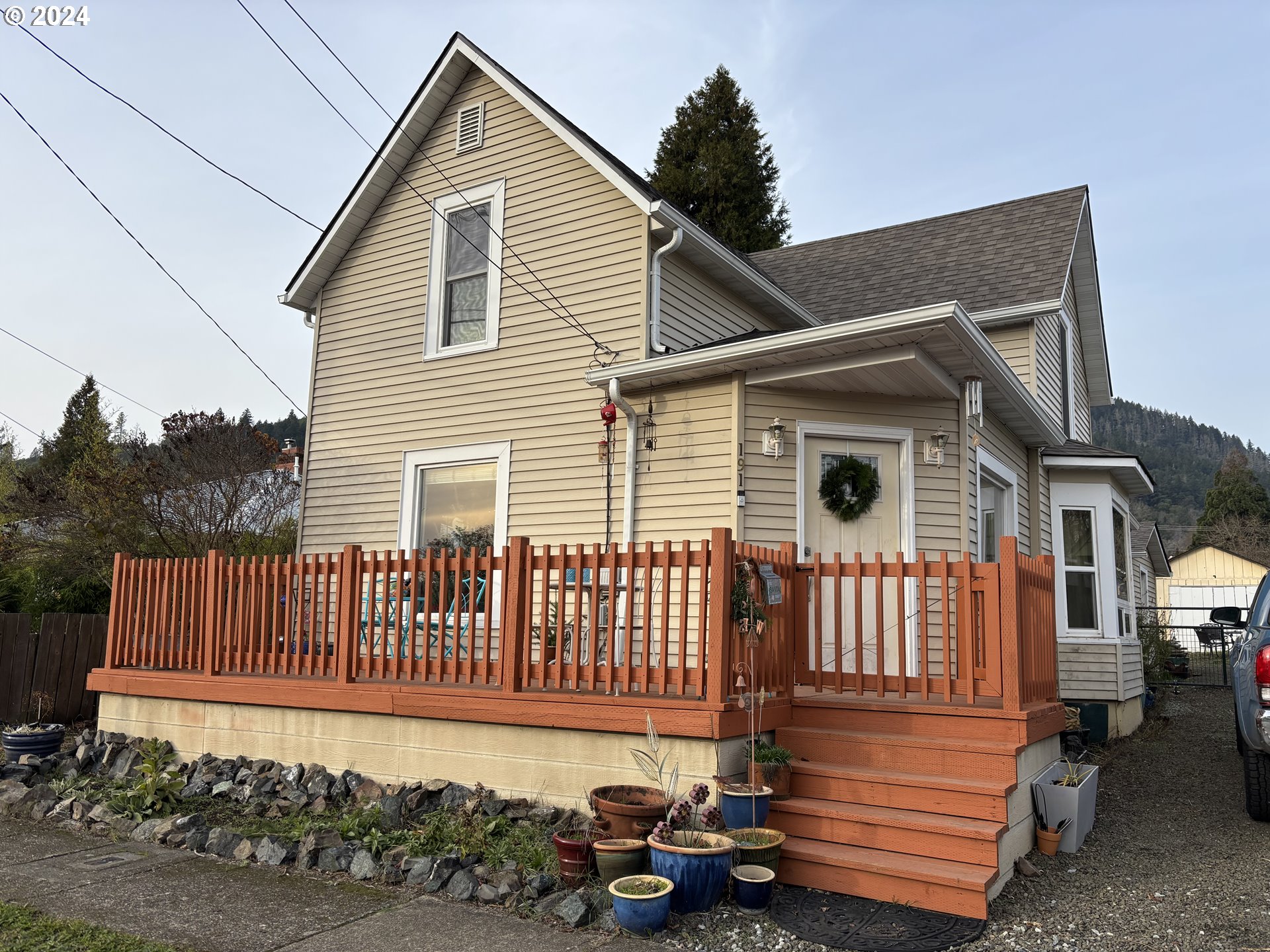 a front view of a house with a garden