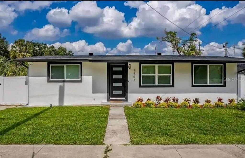 front view of a house with a yard