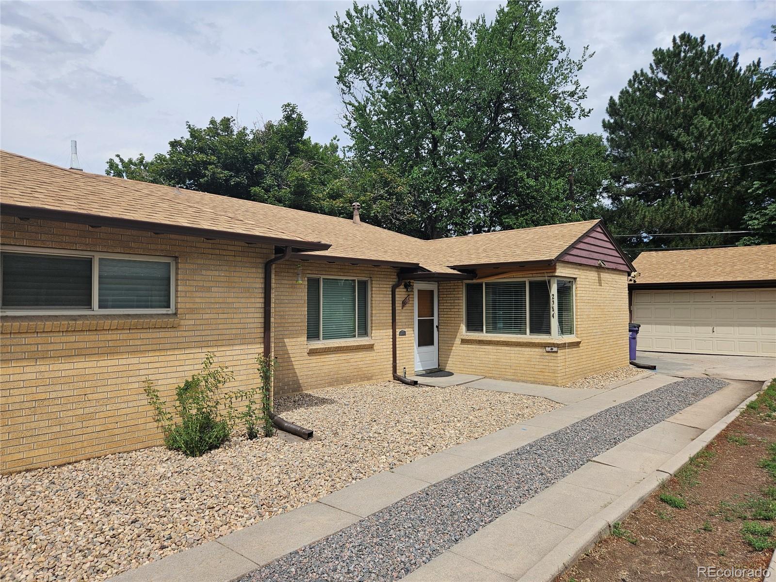 a house with trees in the background