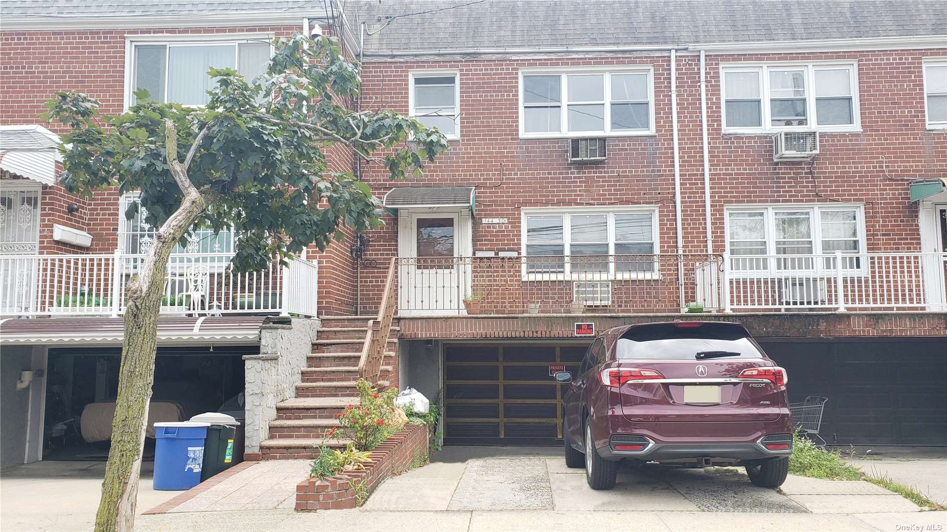 a front view of a house with a garage