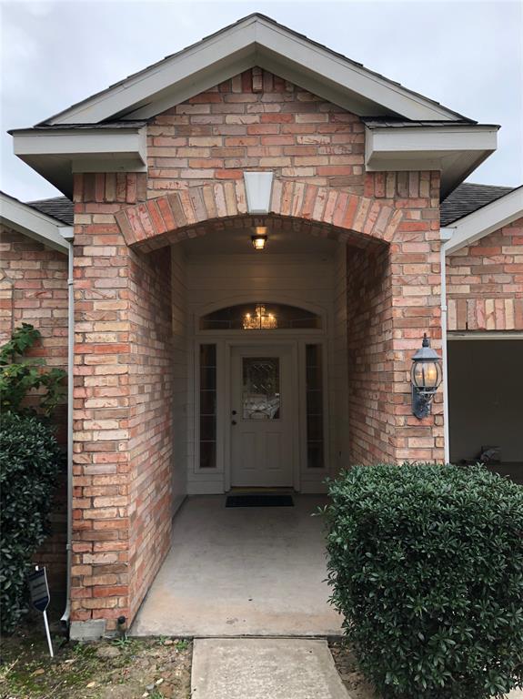 a front view of a house with garage