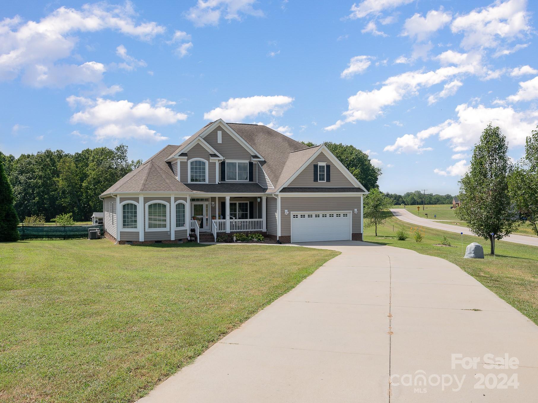 a front view of a house with yard