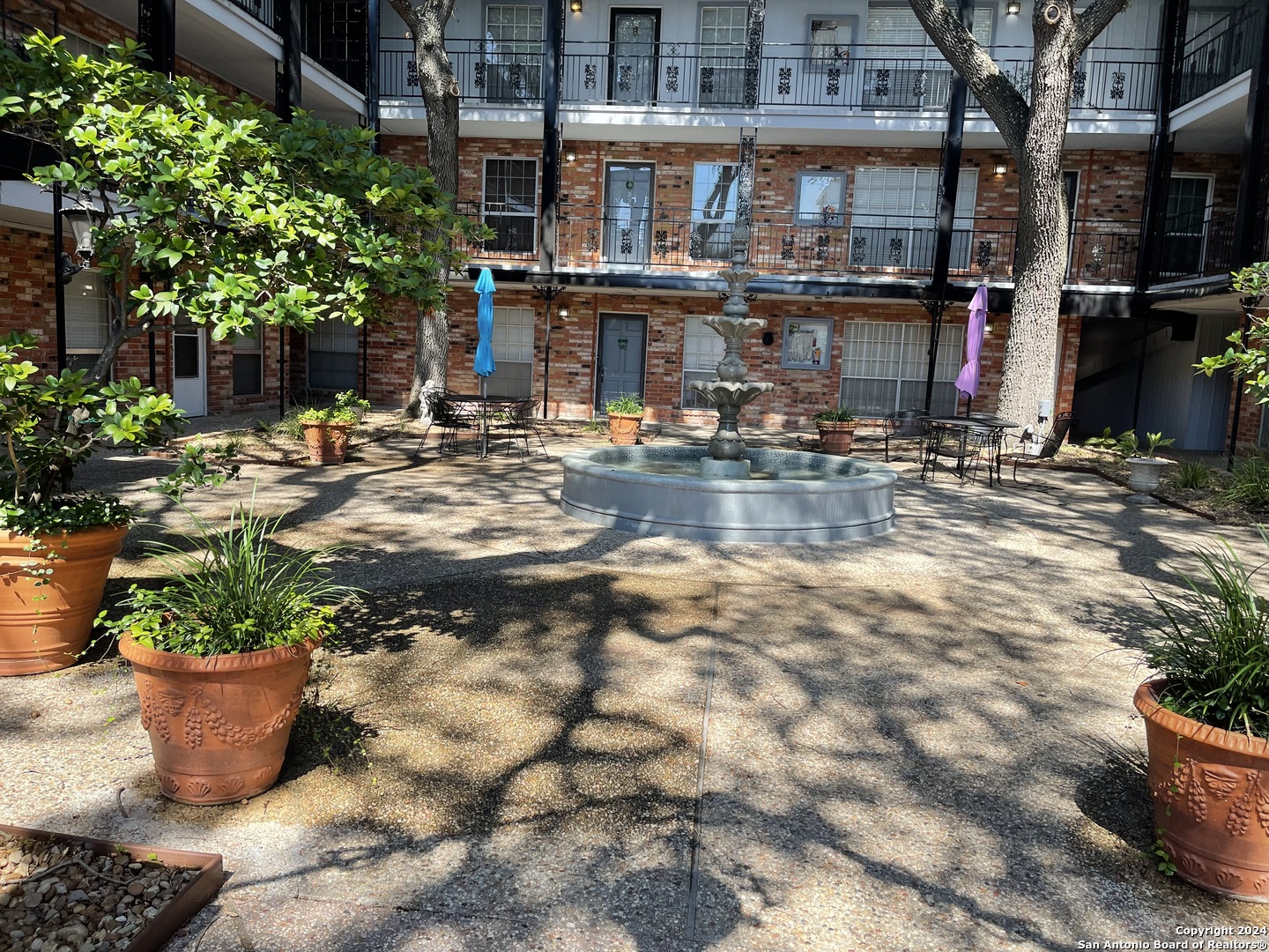 a view of water fountain in front of building