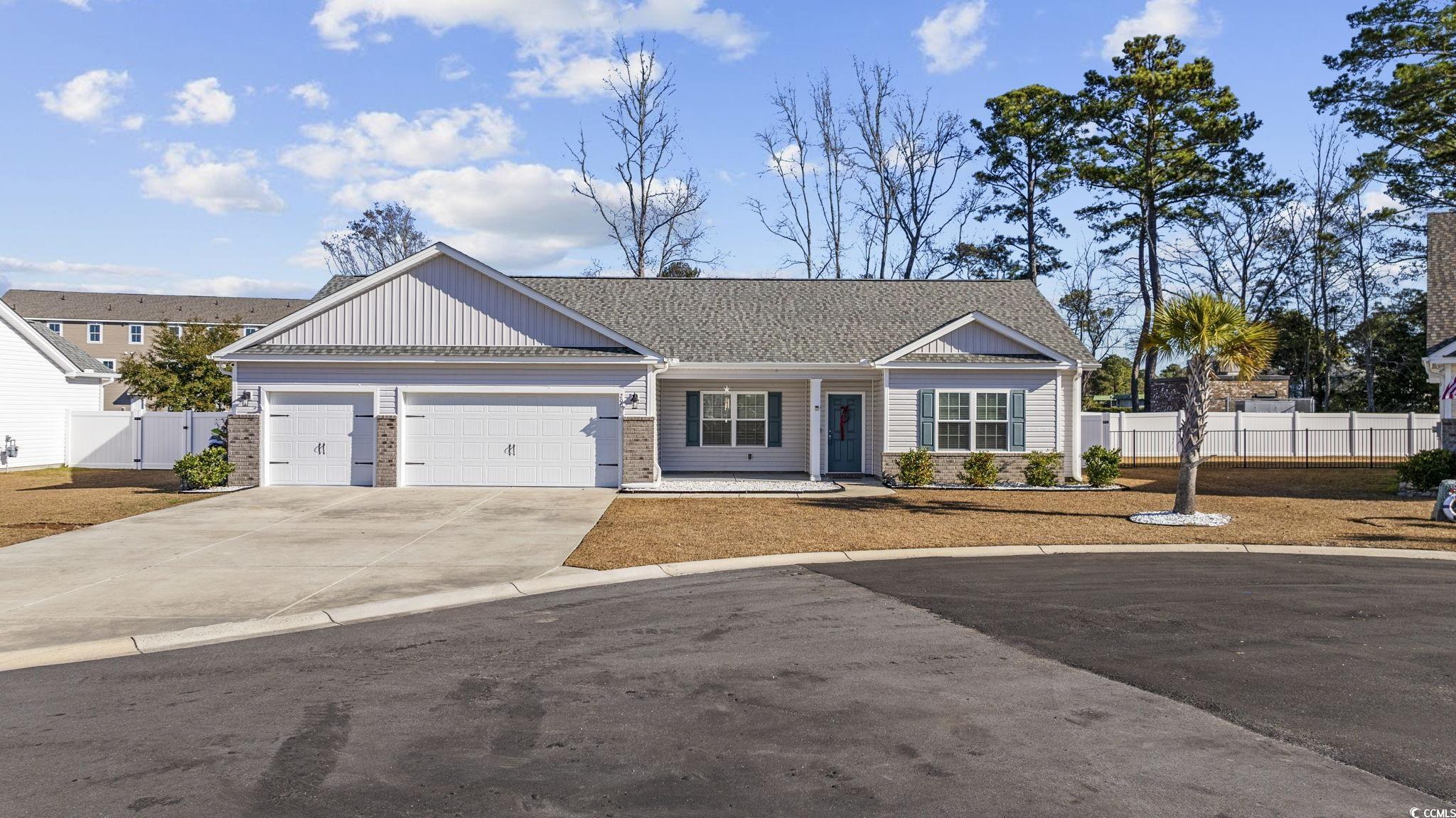 Ranch-style house featuring a garage