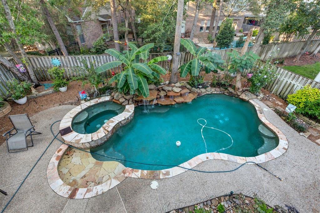 a view of a swimming pool with sitting area