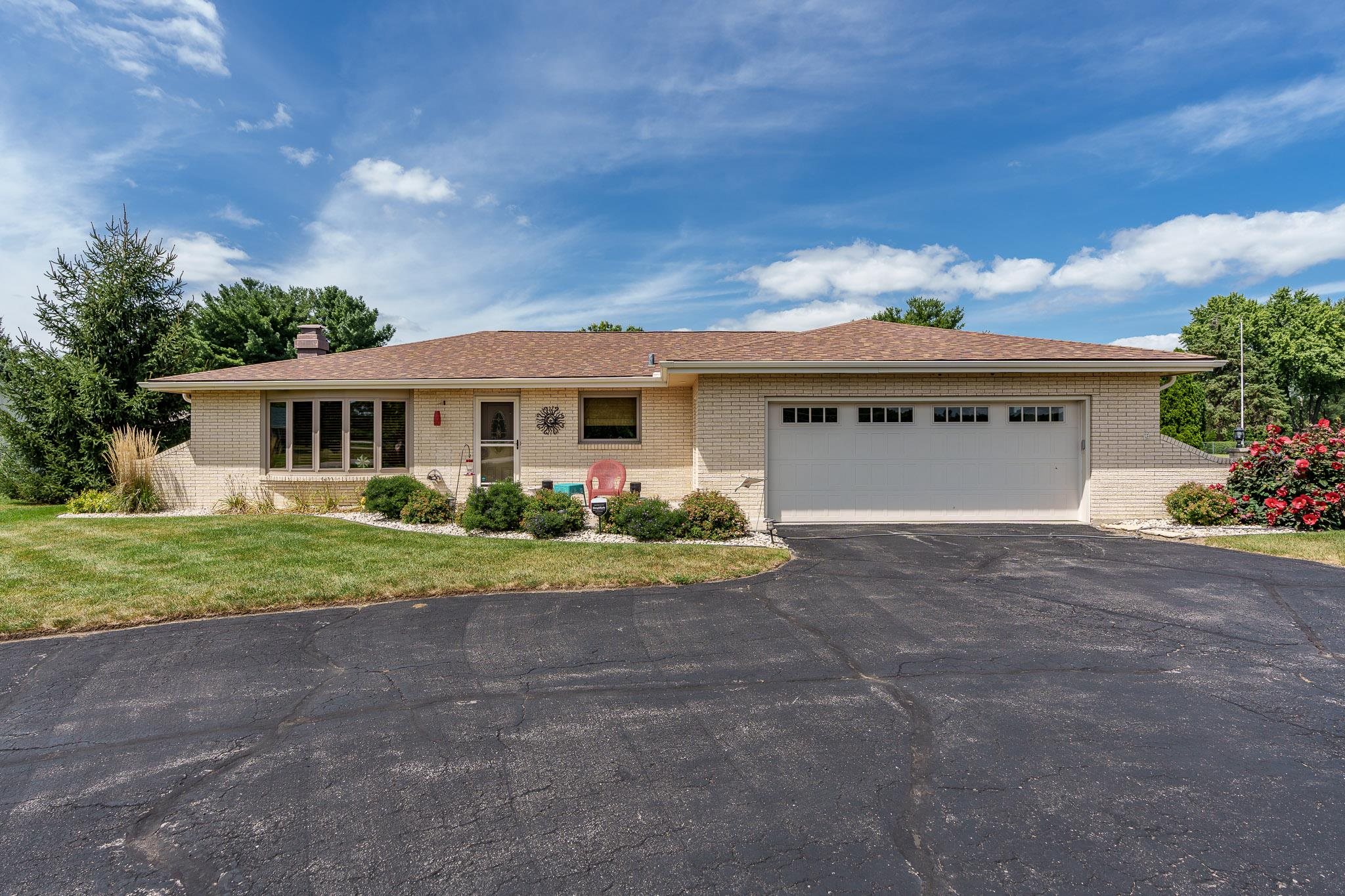 front view of a house with a yard