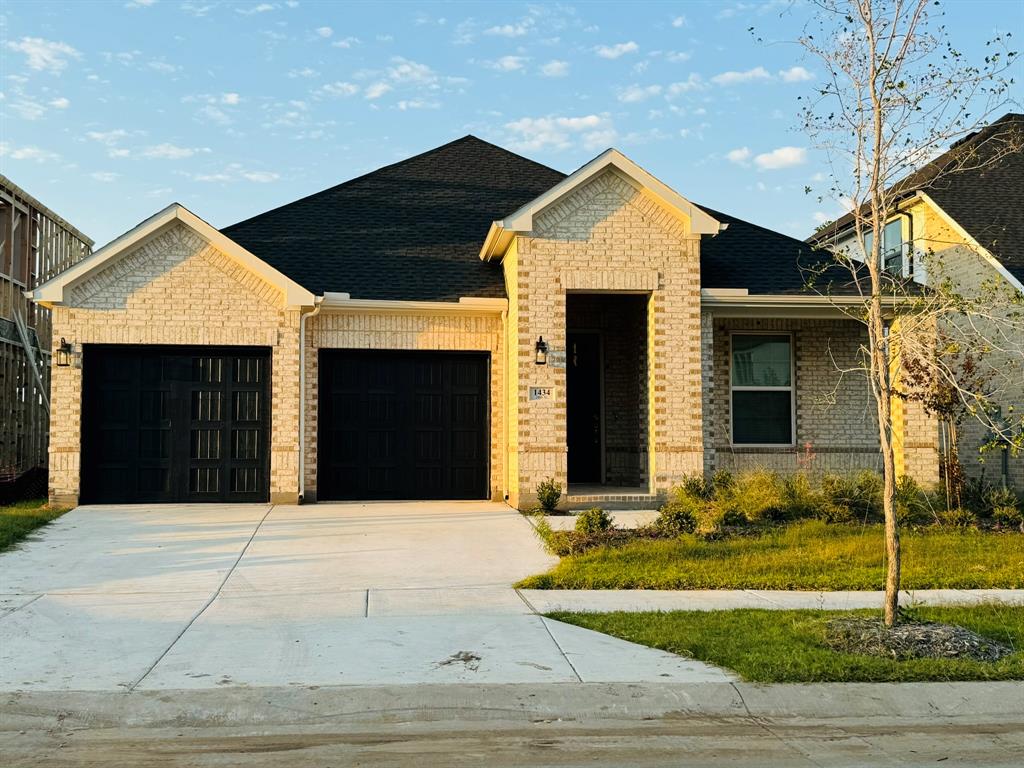 a front view of a house with garage