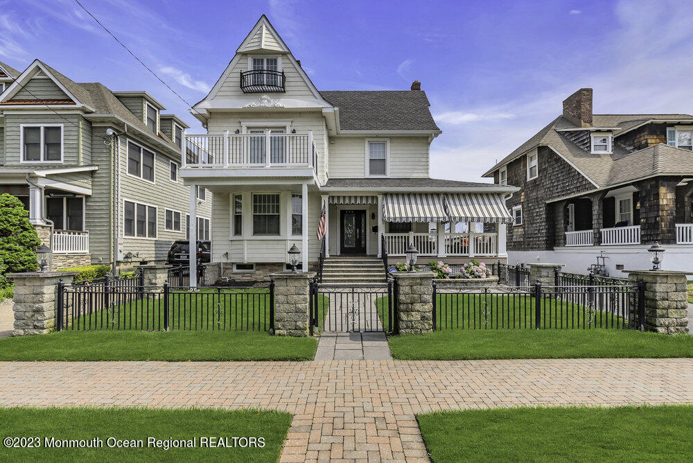 a front view of a house with a garden and patio