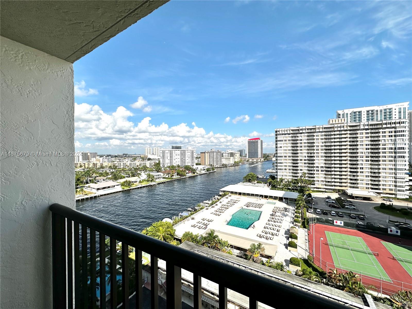 a view of swimming pool from a balcony