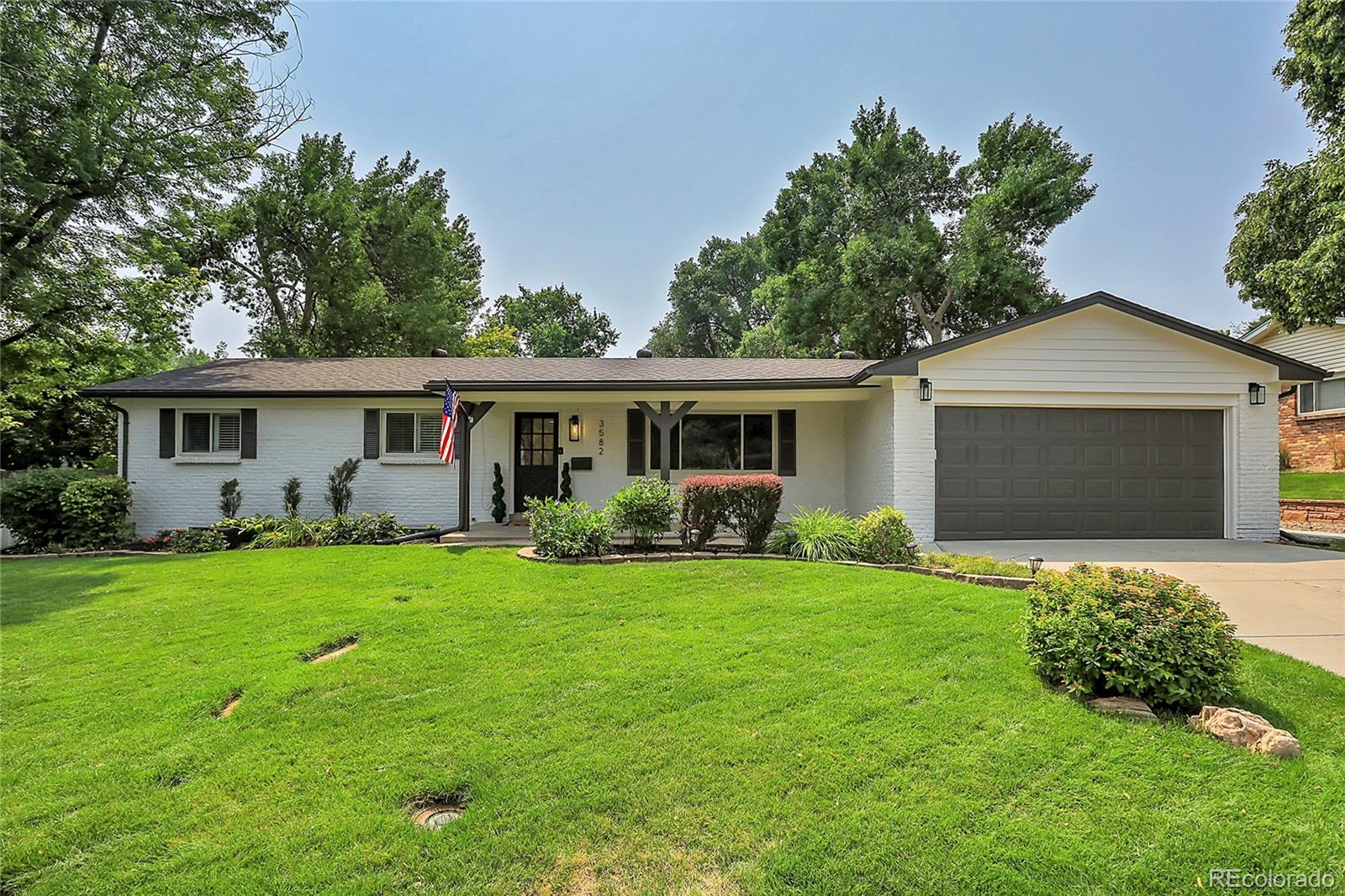 front view of a house and a yard