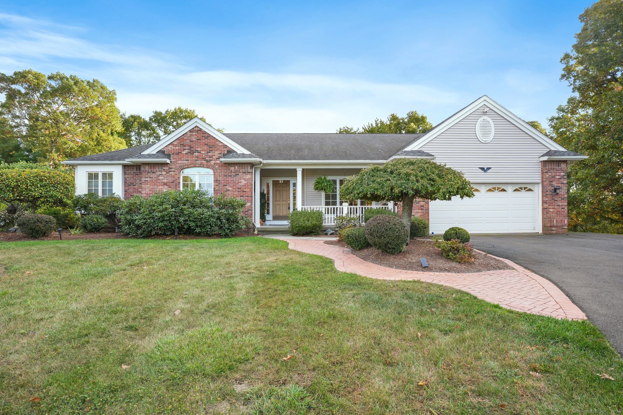 front view of a house with a yard