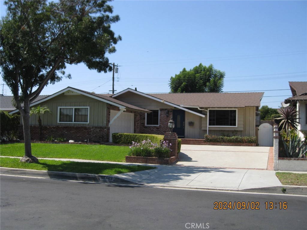 a house that has a tree in front of it