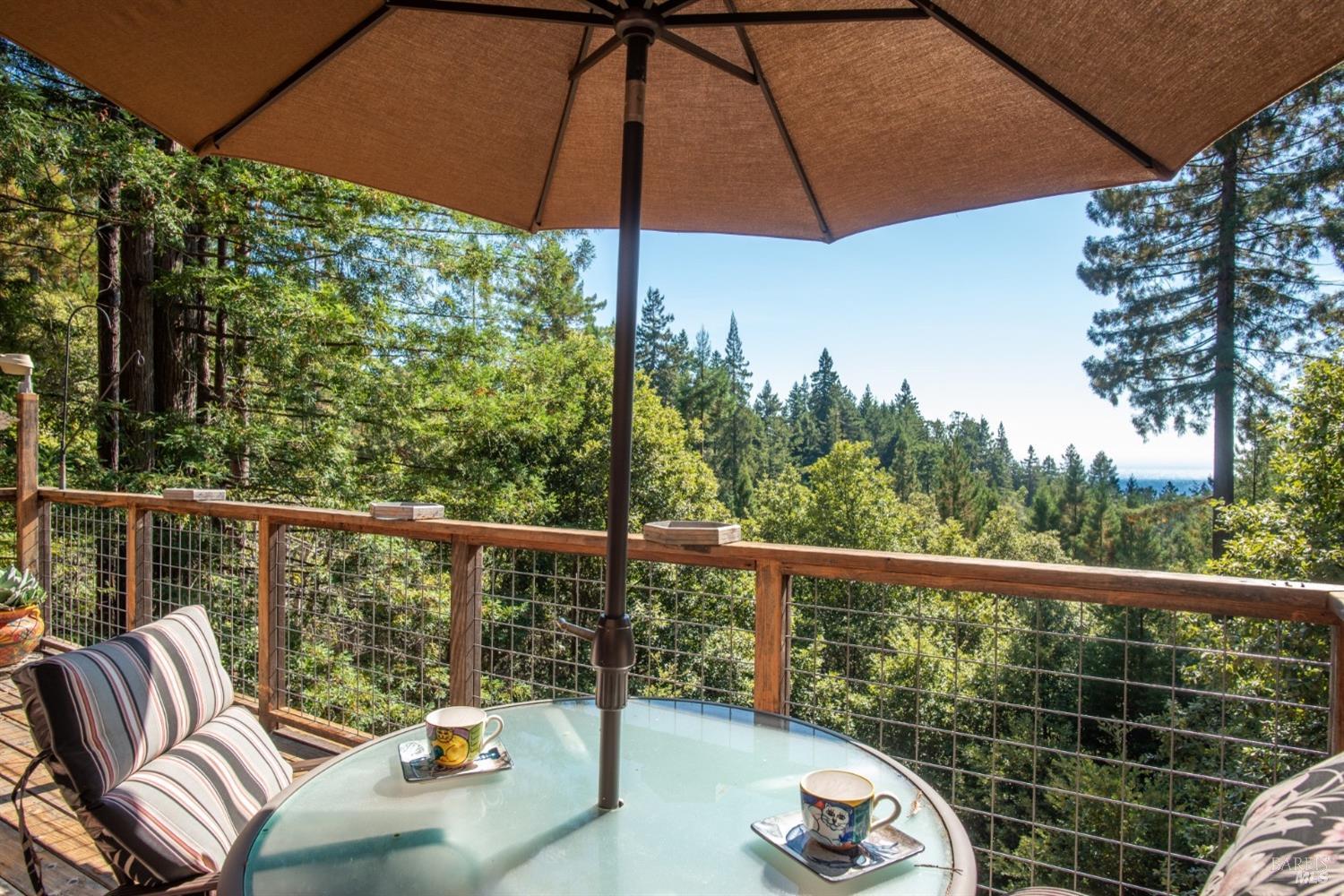 a view of a chair and tables in the balcony