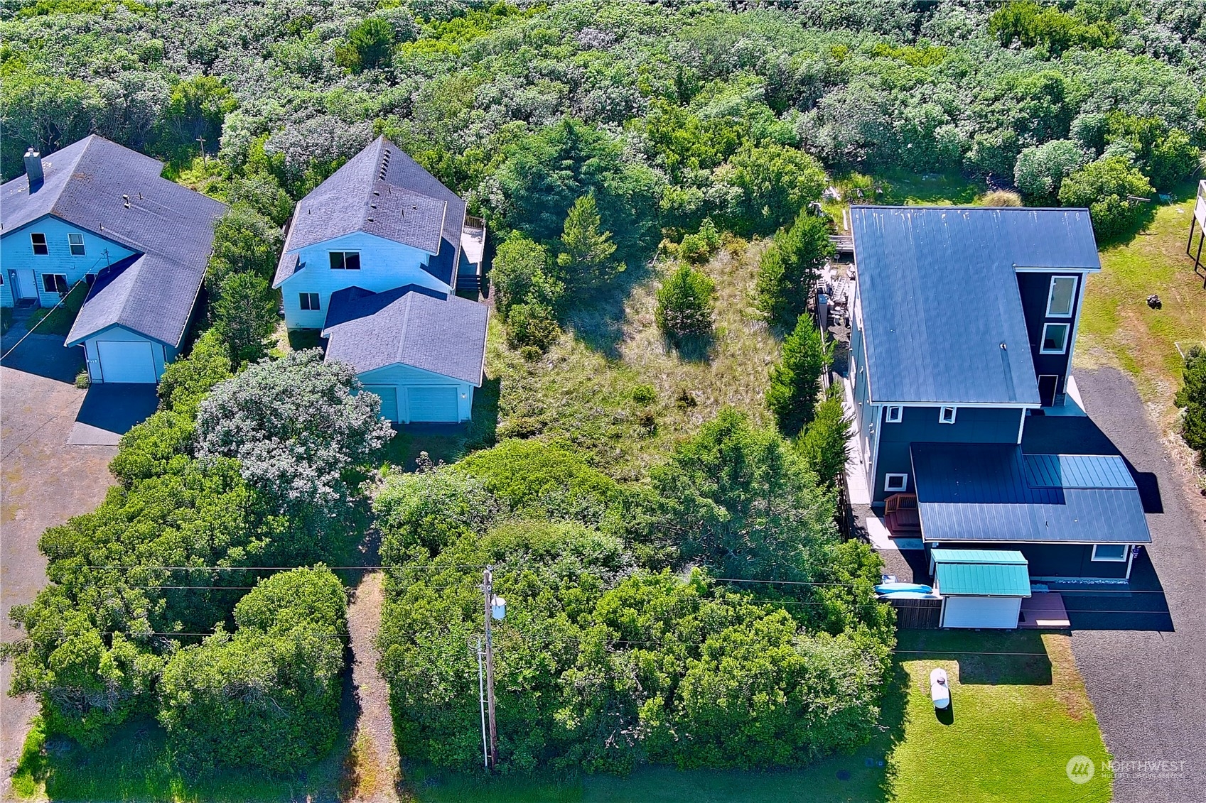 an aerial view of residential house with outdoor space and swimming pool