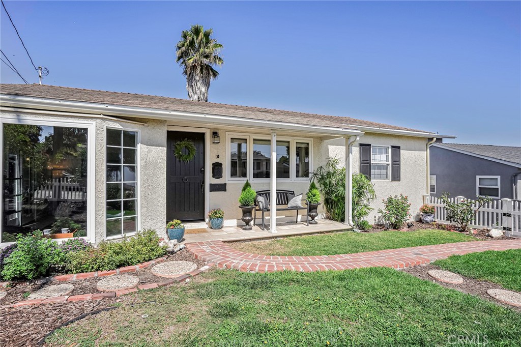 Enclosed front yard provides secure area for children and pets to play.