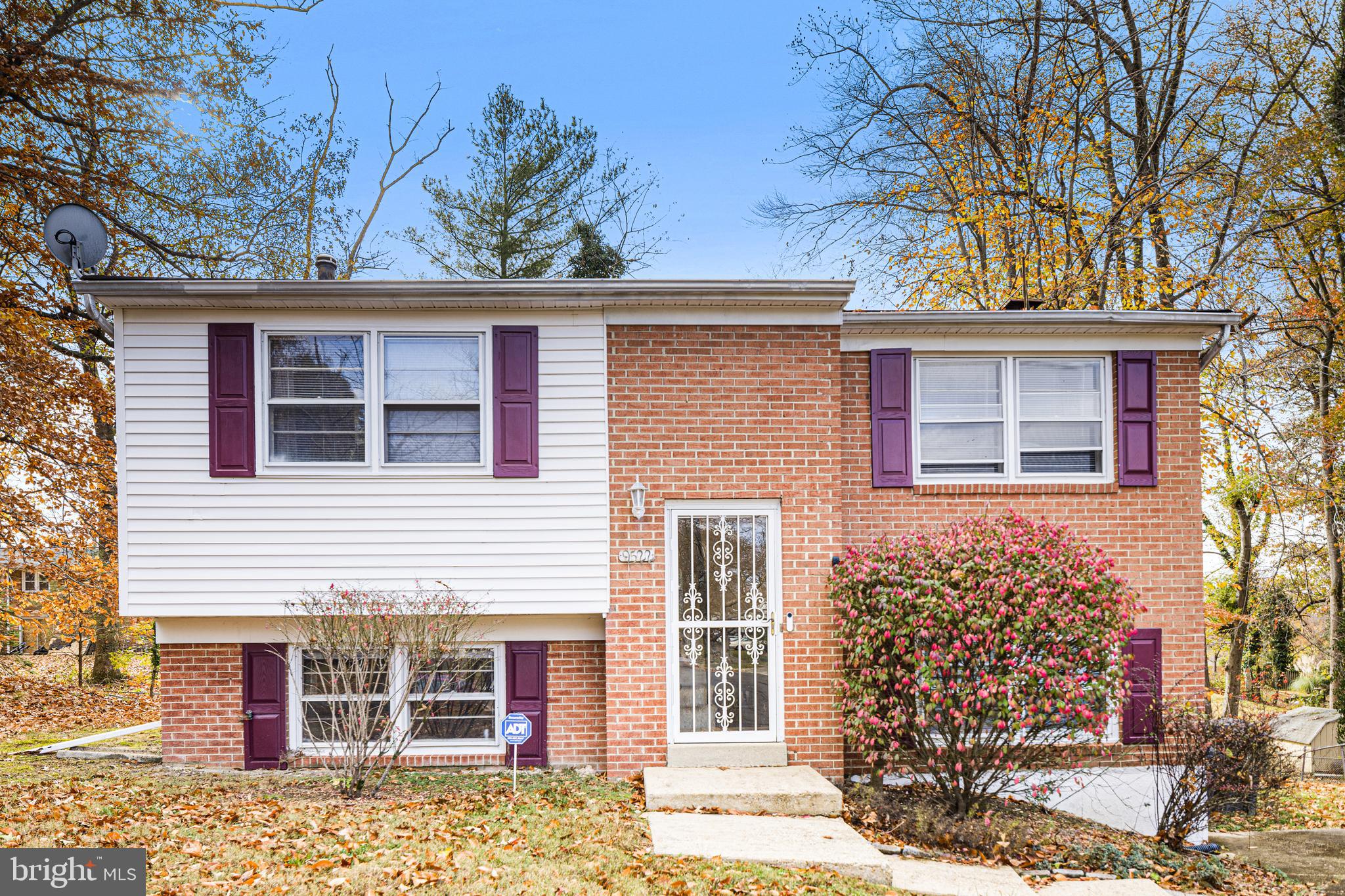 front view of a house with a trees